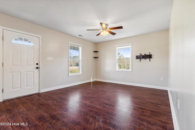 entrance foyer featuring ceiling fan and dark wood-type flooring