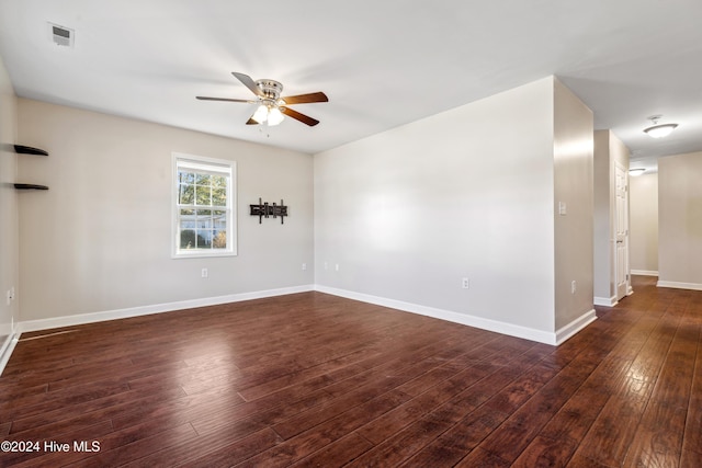 unfurnished room featuring ceiling fan and dark hardwood / wood-style floors