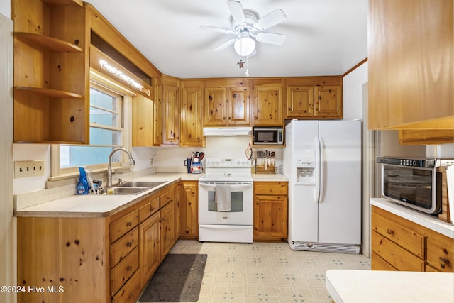 kitchen with ceiling fan, sink, and white appliances