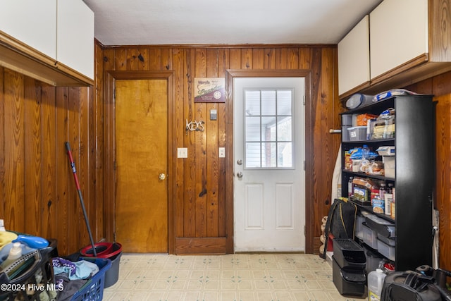 doorway with wooden walls