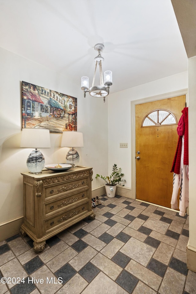 entryway featuring a chandelier