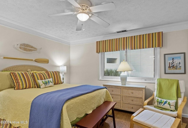 bedroom featuring ceiling fan, crown molding, dark hardwood / wood-style floors, and a textured ceiling