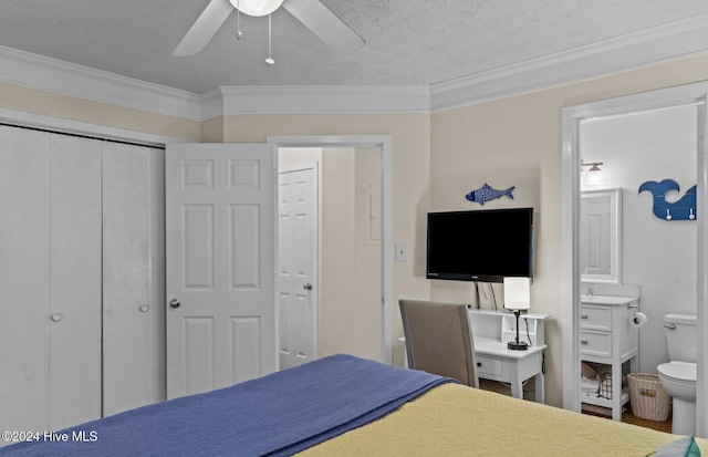 bedroom with ensuite bath, ceiling fan, a textured ceiling, and ornamental molding