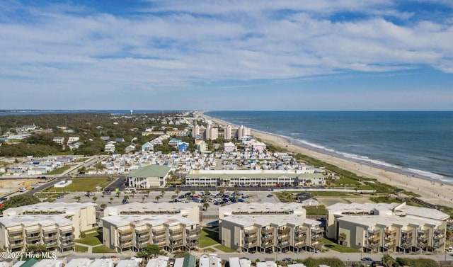 bird's eye view featuring a view of the beach and a water view