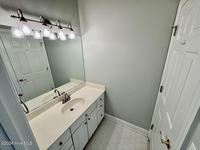 bathroom with tile patterned flooring and vanity