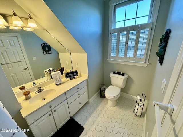 bathroom featuring tile patterned floors, vanity, and toilet