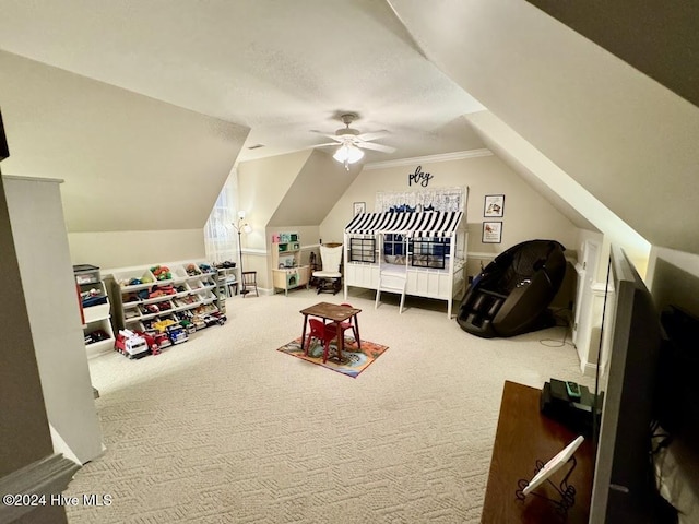 rec room featuring carpet, ceiling fan, crown molding, and vaulted ceiling