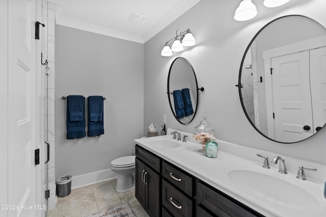 bathroom featuring toilet, vanity, and ornamental molding