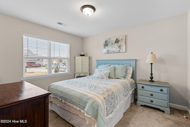 bedroom with light carpet