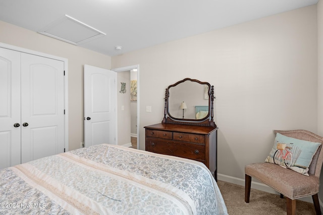 carpeted bedroom featuring a closet