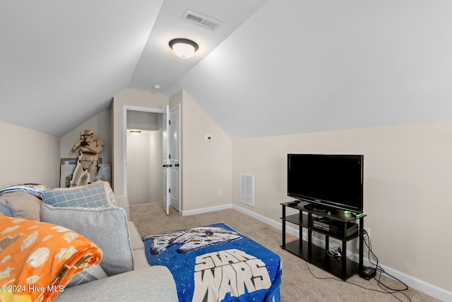 interior space featuring lofted ceiling and light carpet