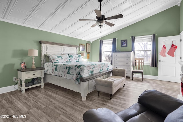 bedroom featuring vaulted ceiling, light hardwood / wood-style flooring, and ceiling fan