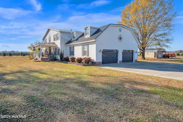 view of side of property with a lawn