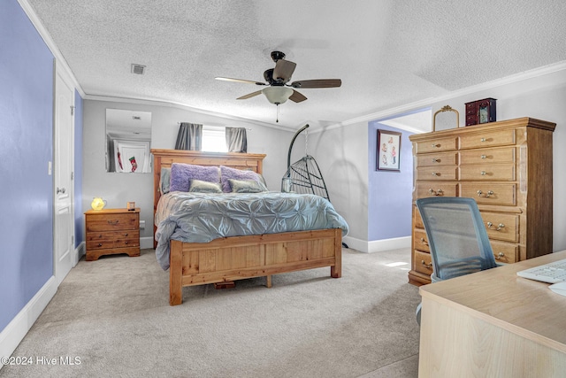 bedroom with ceiling fan, light colored carpet, a textured ceiling, and crown molding