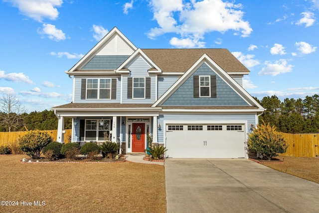 craftsman inspired home with a front lawn and a garage