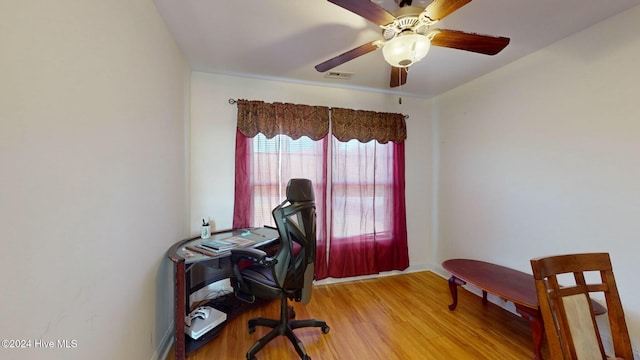 office space featuring ceiling fan and light hardwood / wood-style flooring