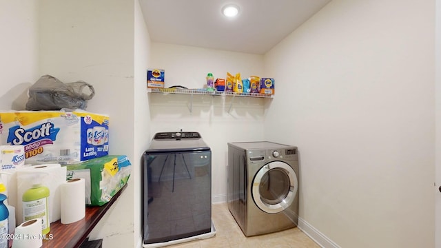 washroom featuring independent washer and dryer