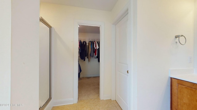 hallway featuring light tile patterned floors