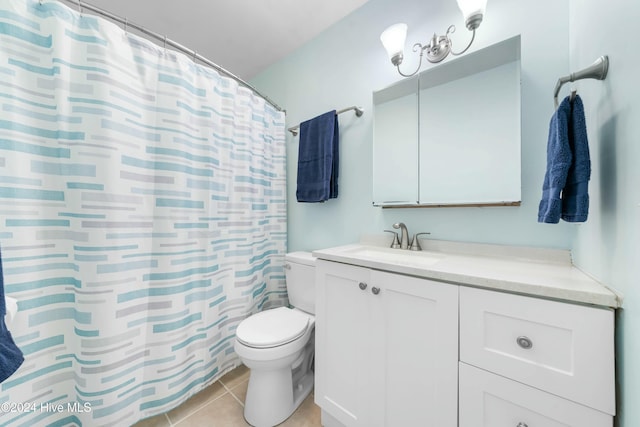 bathroom featuring tile patterned floors, walk in shower, vanity, and toilet