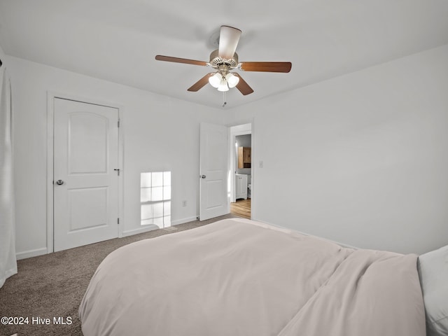 carpeted bedroom with ceiling fan