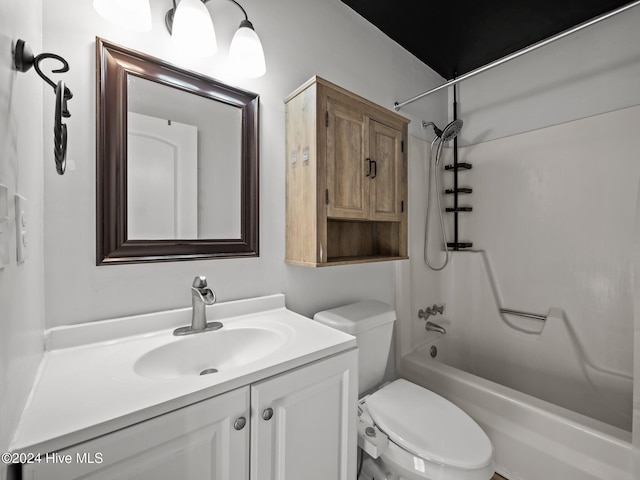 full bathroom featuring bathtub / shower combination, vanity, and toilet