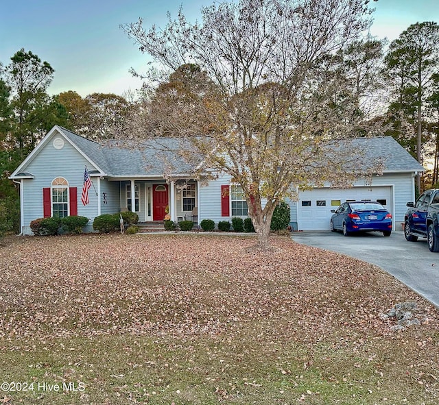 ranch-style home with a garage