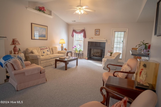 living room with a wealth of natural light, carpet floors, and lofted ceiling