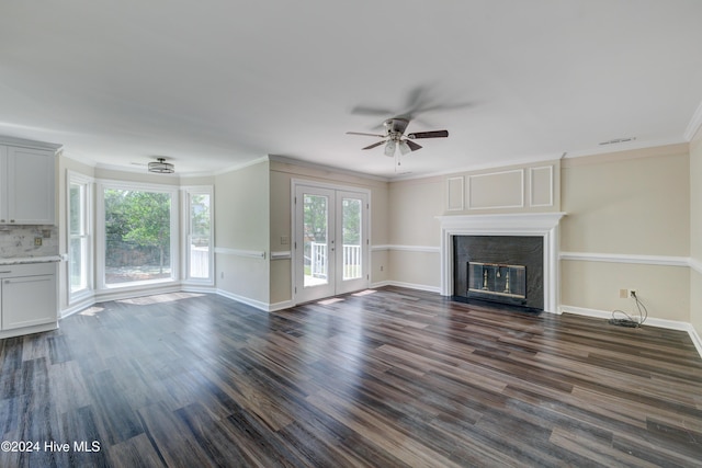 unfurnished living room with dark hardwood / wood-style flooring, crown molding, french doors, and ceiling fan