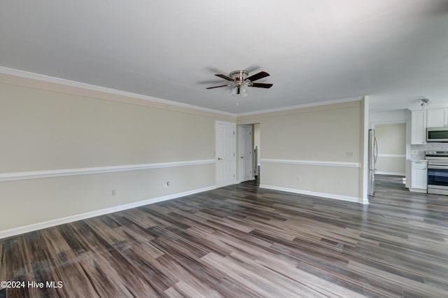 spare room featuring dark hardwood / wood-style floors, ceiling fan, and crown molding