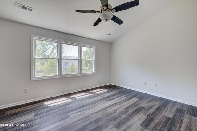 unfurnished room with ceiling fan, dark wood-type flooring, and vaulted ceiling