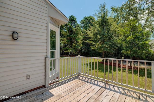 deck featuring a lawn