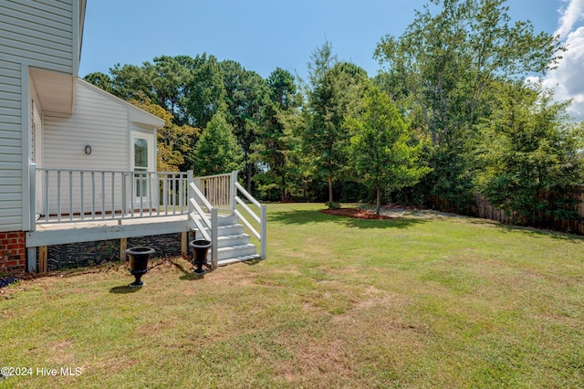 view of yard featuring a wooden deck