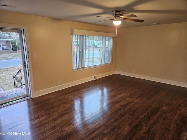 unfurnished room featuring ceiling fan and dark hardwood / wood-style floors