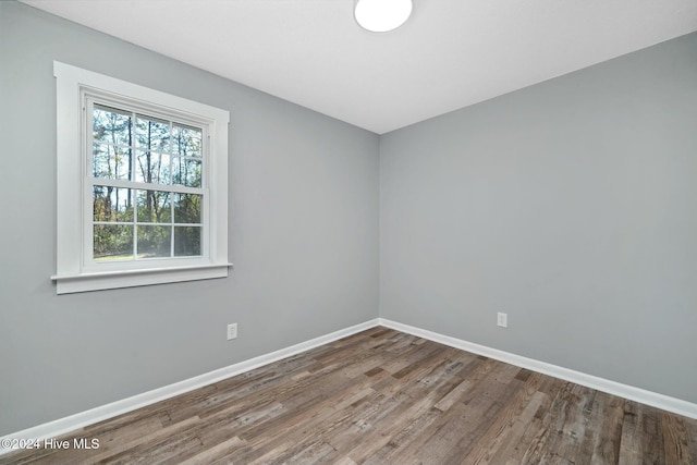 unfurnished room featuring hardwood / wood-style floors