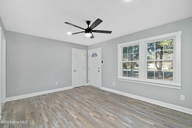 unfurnished room featuring hardwood / wood-style floors and ceiling fan