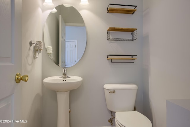 bathroom with toilet and sink