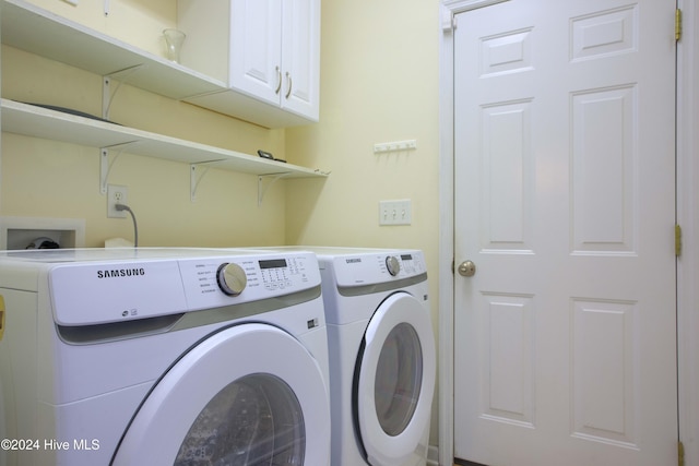 laundry area with cabinets and washer and dryer