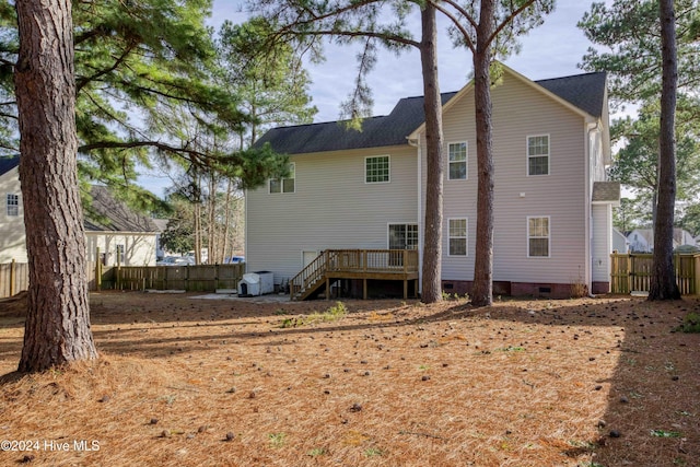 rear view of property with a wooden deck