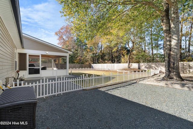 view of yard featuring a sunroom