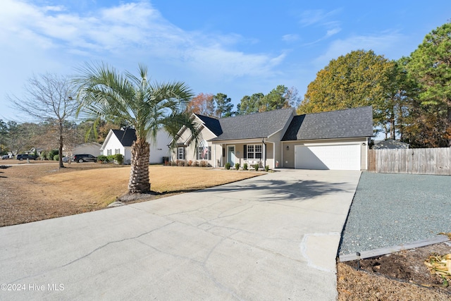 view of front facade featuring a garage and a front yard