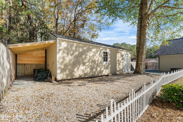 view of home's exterior with a carport