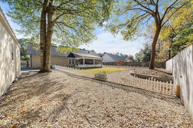 view of yard featuring a sunroom