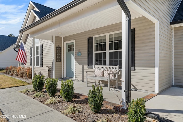 property entrance with covered porch