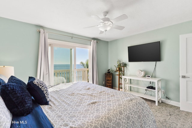 carpeted bedroom featuring access to exterior and ceiling fan