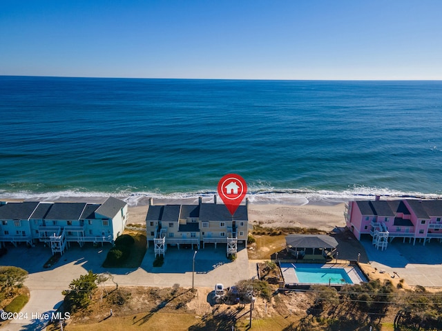 drone / aerial view with a beach view and a water view