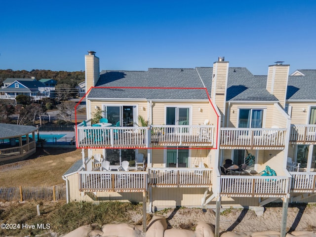 rear view of property with a wooden deck