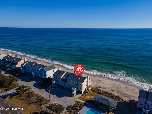 bird's eye view with a beach view and a water view