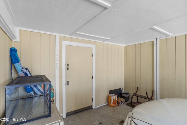 bedroom with wood walls