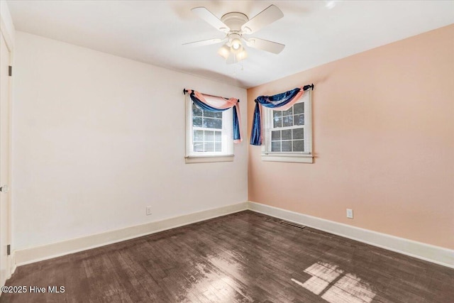 empty room featuring dark hardwood / wood-style floors and ceiling fan