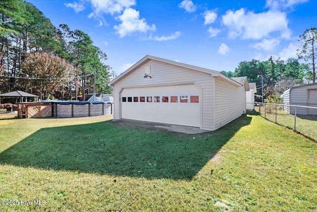 garage featuring a yard